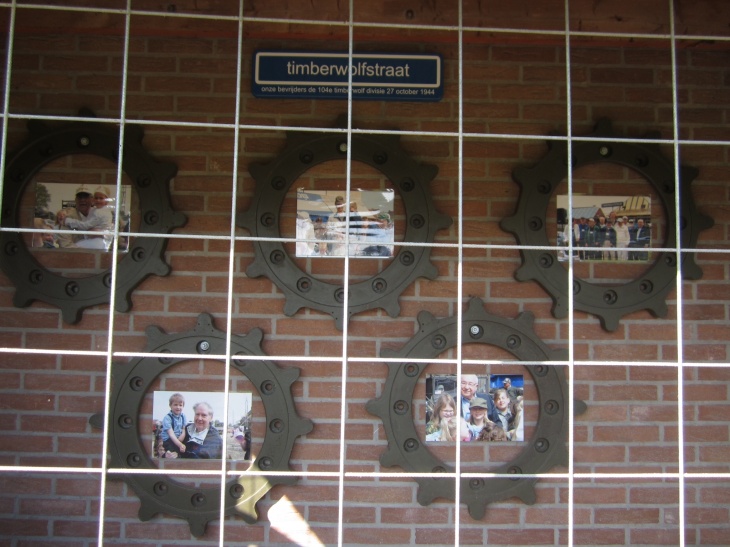Photos of previous tours displayed at the entrance.